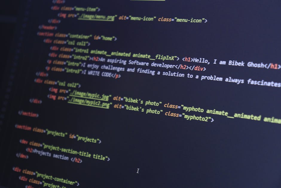 The image displays a close-up of a computer screen with lines of colourful HTML and CSS code in focus. The code features tags such as <h1>, <div>, <img>, and <section>, with various style attributes i